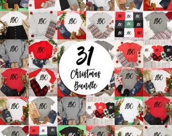May include: A collection of 31 Christmas-themed t-shirts and sweatshirts in various colours and styles. The shirts feature the text "LBC" in black lettering.