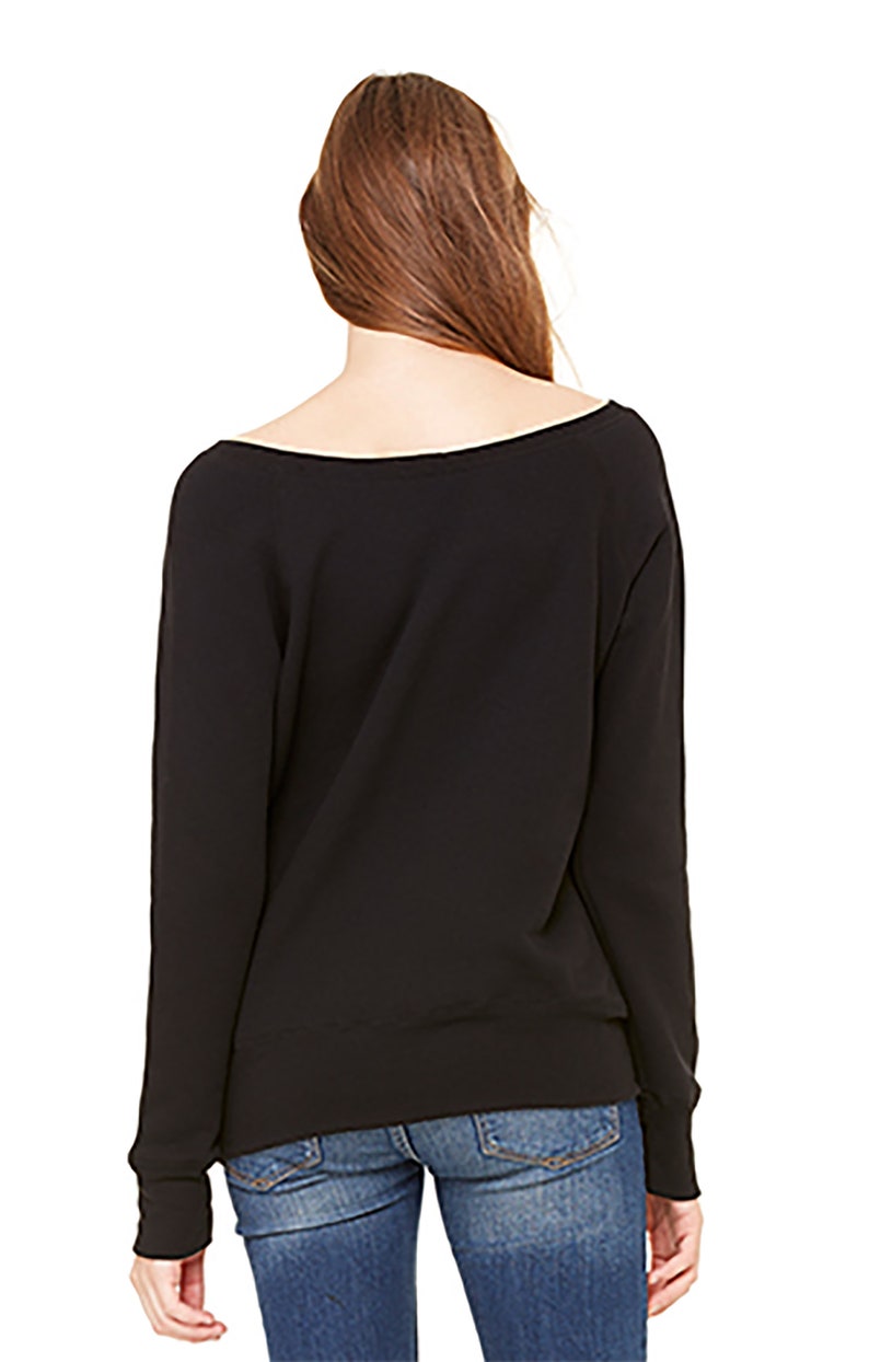 Saturdays In Norman on a classic pullover fit fleece sponge sweatshirt that can be worn pulled off the shoulder.