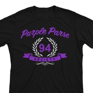 May include: Black t-shirt with purple text that reads "Purple Parse 94 Society".