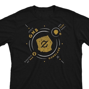 May include: Black t-shirt with a gold design featuring a stylized gunblade, the text "GNB", "FFXIV", "Disciple of War", and "Gunblade".