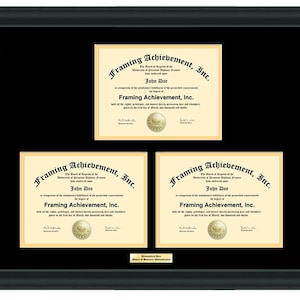 May include: A black framed triple matted diploma with a gold seal. The diploma is for John Doe and is from Framing Achievement, Inc.