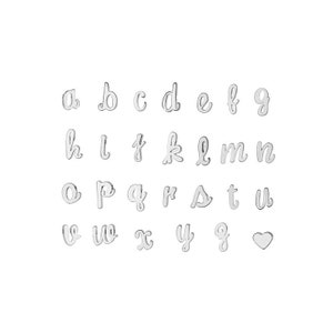 May include: A set of silver cursive alphabet letter charms with a heart charm. The charms are arranged in alphabetical order.