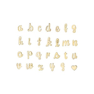 May include: Gold-toned alphabet letter charms in a cursive font. The letters are arranged in alphabetical order, with a heart charm at the end.