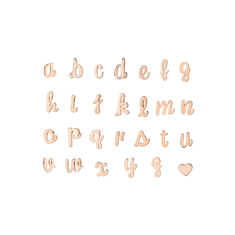 May include: A set of gold-toned metal alphabet letter charms, including a heart charm. The letters are in a cursive script font.