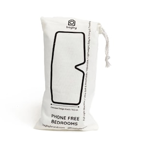 May include: White cotton drawstring bag with black text that reads "bagby" and "PHONE FREE BEDROOMS". The bag is designed to hold a sleep mask and has a black outline of a sleep mask on the front. The text also reads "Full Light Blockout / Ultra Soft & Breathable / Adjustable / Lightweight, Easy to Carry & Travelling" and "Oversized Design 4 inch / 10.2 cm".