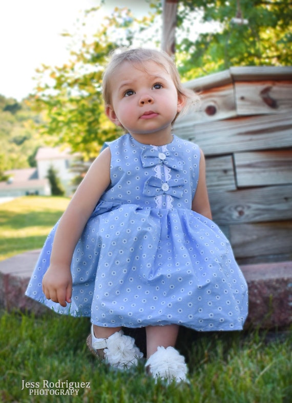 baby girl in blue dress