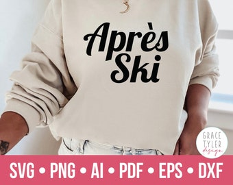 Könnte beinhalten: Ein beiger Pullover mit dem Text "Aprés Ski" in schwarzen Buchstaben.