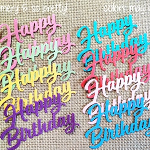 May include: A collection of die-cut paper phrases reading Happy Birthday in various colors including pink, green, yellow, purple, red, white, and blue. The text features a cursive script font with a shimmery finish. Text reads shimmery & so pretty! and colors may vary.