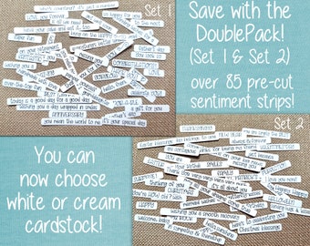 May include: A collection of white paper sentiment strips featuring various printed phrases like "LOVE you forever," "CONGRATULATIONS," and "HAPPY." The strips are organized into two distinct sets, labeled Set 1 and Set 2, and are displayed on a textured surface.