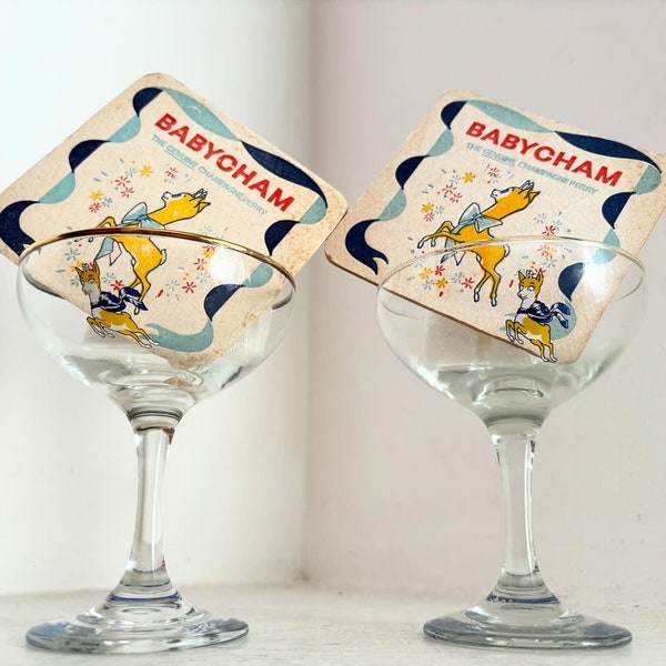 A Pair of Vintage 1970s Babycham Coupe Glasses With Vintage Mats