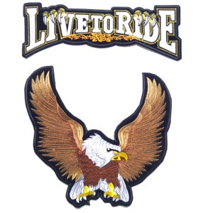 May include: Two embroidered patches, one with the words "Live to Ride" in white with gold accents on a black background, and the other with a brown eagle with white head and yellow talons on a black background.