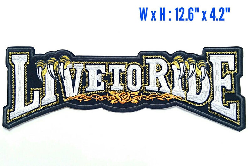 May include: Black embroidered patch with white lettering that reads "Live to Ride". The lettering is outlined in gold and has a gold barbed wire design with a rose underneath. The patch measures 12.6 inches wide by 4.2 inches high.