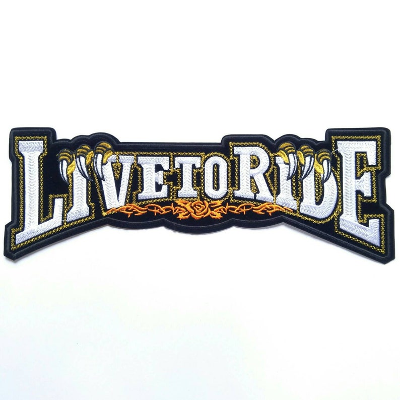 May include: Black embroidered patch with white lettering that reads "Live to Ride". The lettering is outlined in gold and there are gold claws on either side of the text.