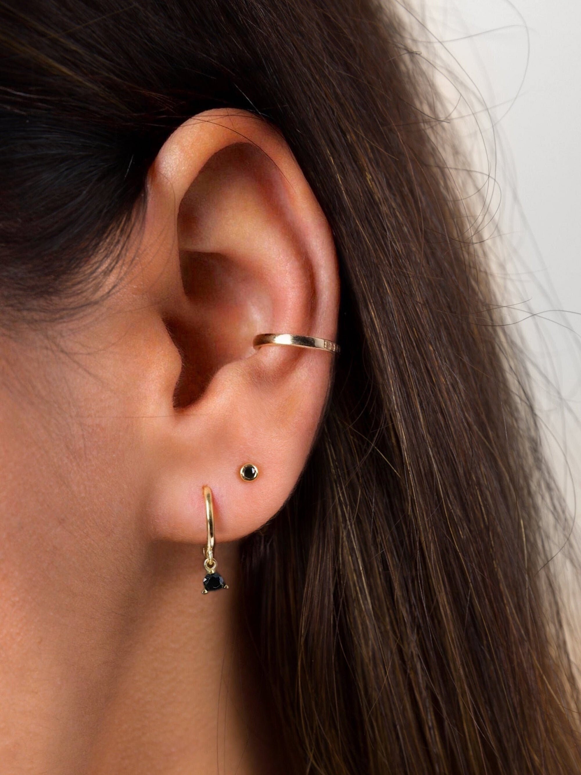Black stone studs gold hotsell