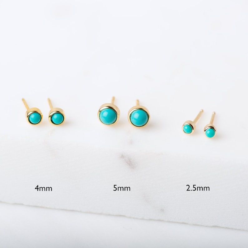 May include: Three pairs of gold stud earrings with turquoise stones. The earrings are shown in three sizes: 2.5 mm, 4 mm, and 5 mm.
