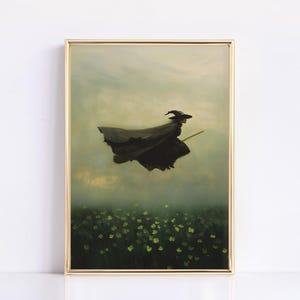 May include: A framed painting of a witch flying on a broomstick over a field of green flowers. The witch is wearing a black cloak and a pointed hat. The sky is a hazy blue with clouds.