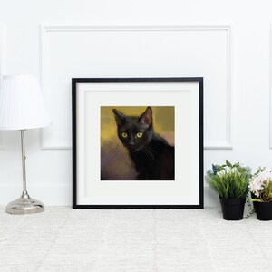 May include: A framed painting of a black cat with green eyes looking directly at the viewer. The cat is sitting on a yellow and purple background.