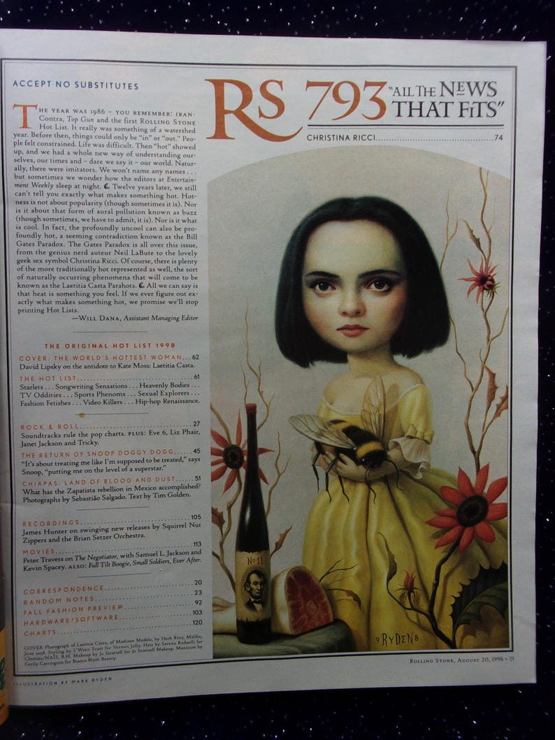 May include: A magazine cover featuring a painting of a young girl with dark hair holding a bee. The magazine is titled "Rolling Stone" and the issue number is 793. The cover also features the text "All the News That Fits" and the name "Christina Ricci".