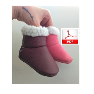 May include: Two pairs of baby booties, one burgundy and one pink, with white faux fur lining. The booties are made of leather and have a soft, comfortable feel. PDF.