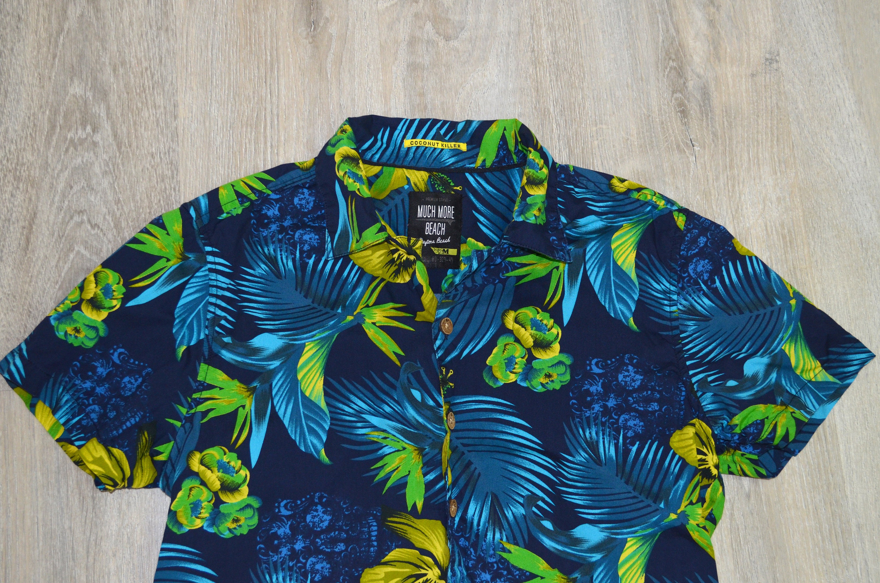 blue shirt with palm trees