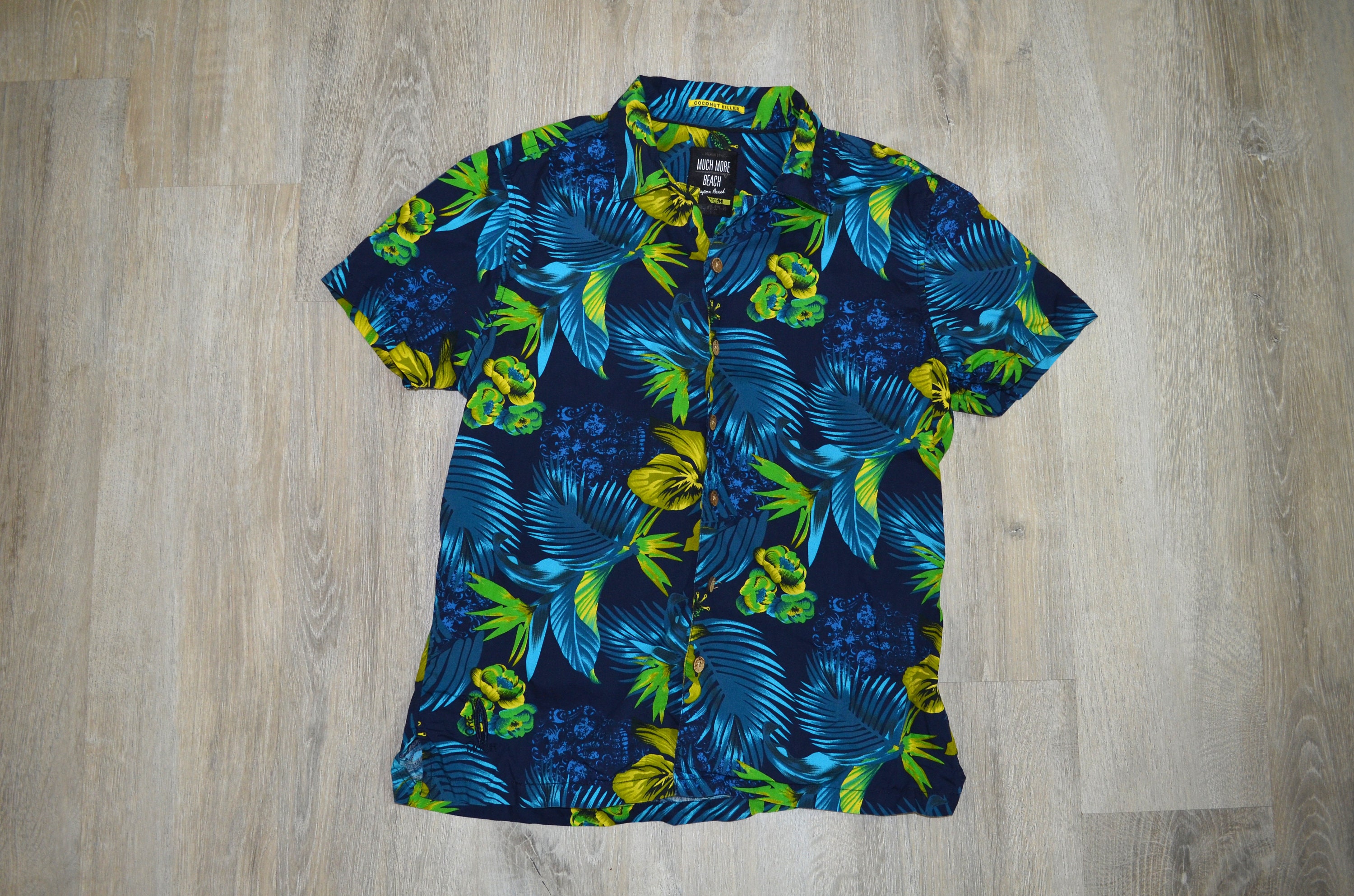 blue shirt with palm trees