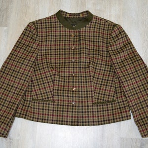 May include: A brown, green, and red plaid blazer with a mandarin collar and gold buttons.