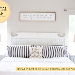 May include: A white bedroom with a white bed frame and a white headboard. The bed has a white duvet and two black and white striped pillows. There is a white nightstand on each side of the bed with a lamp on each. The wall above the headboard has a wooden sign with the text "family is not just an important thing... family is everything".