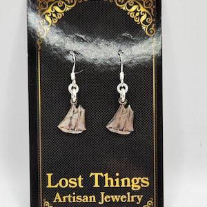 Handcut Canadian silver dime earrings featuring the iconic Bluenose ship.