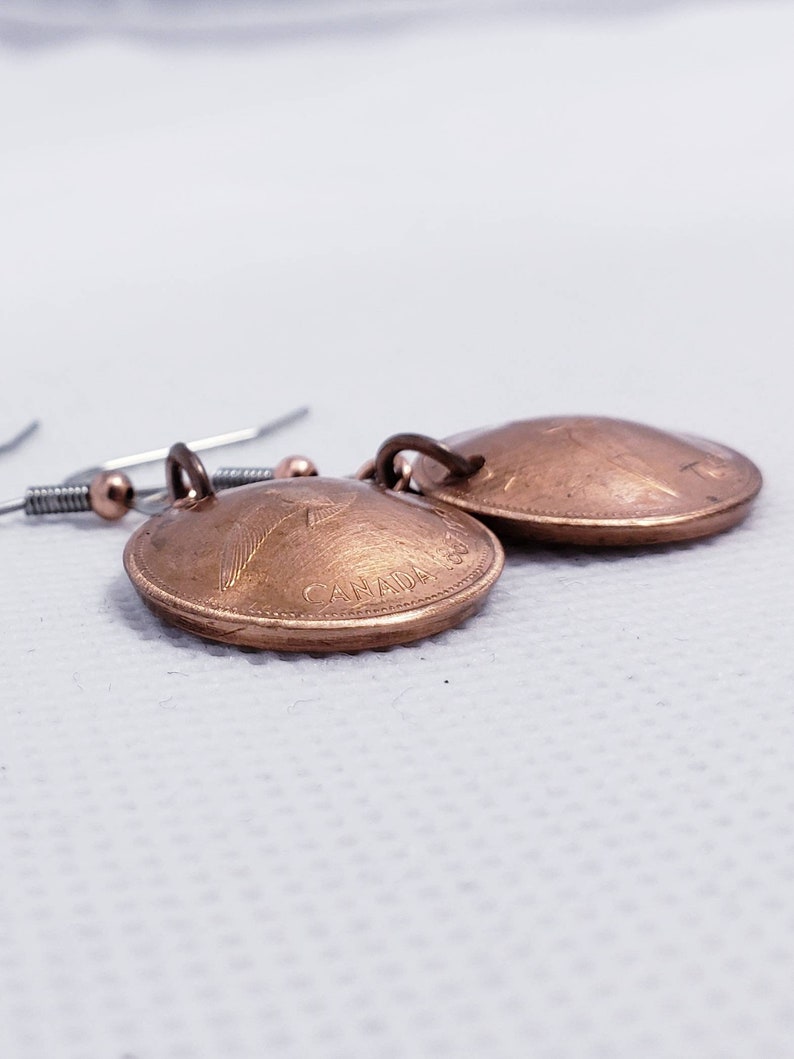 Coin earrings hand made with 1967 Canadian Centennial pennies.