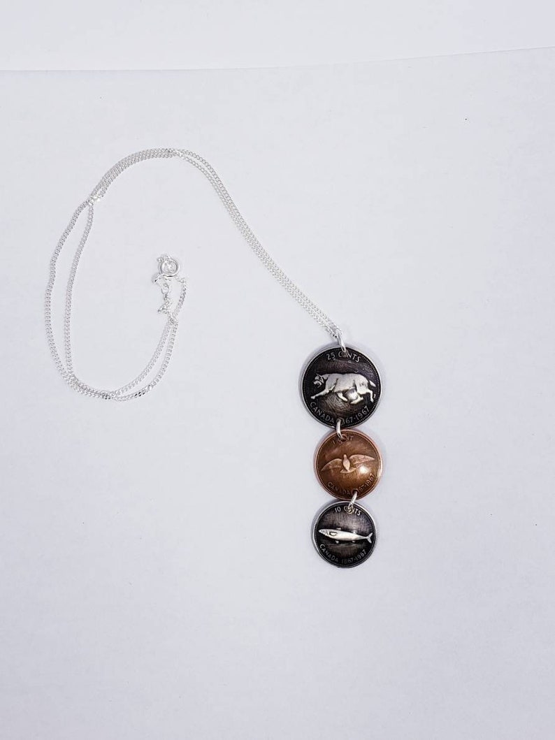 Coin necklace Handmade coin pendant using 1967 Canadian centennial coins.