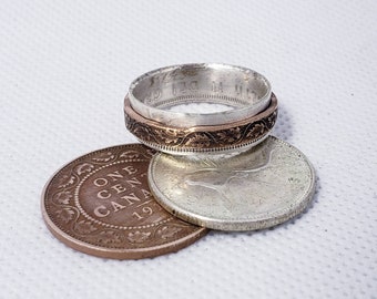 Spinner coin ring. Handmade from old silver Canadian quarters and 100+ year old Canadian pennies.