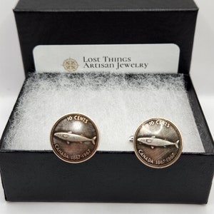 Coin cuffnlinks made with silver 1967 Canadian centennial dimes.