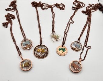 Hand carved Canadian penny necklaces. All one of a kind.