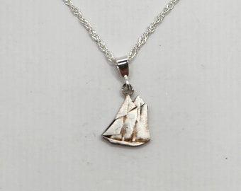 Hand cut Canadian silver dime pendant showcasing the iconic Bluenose Ship.