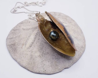 Spoon necklace. Oyster pendant with black pearl made from sterling silver spoons.