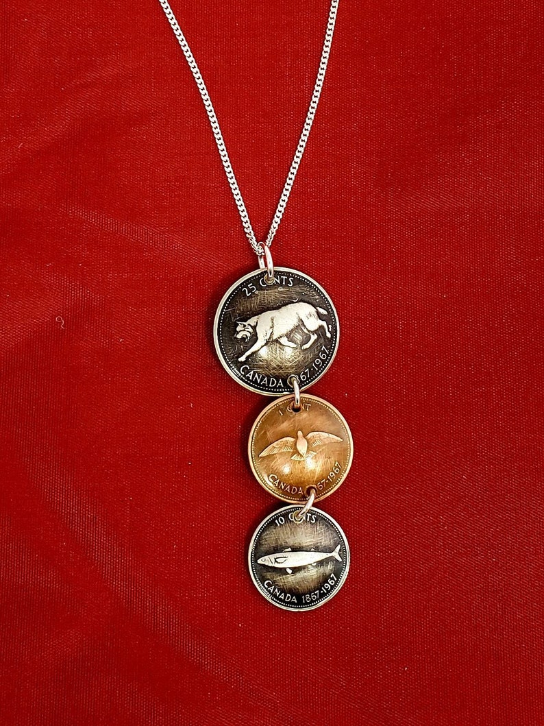 Coin necklace Handmade coin pendant using 1967 Canadian centennial coins.