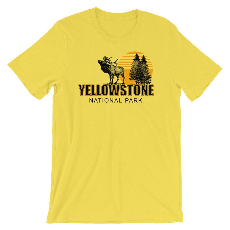 May include: Yellow T-shirt with a black and white illustration of an elk, trees, and a sun. The text "Yellowstone National Park" is printed in black on the shirt.