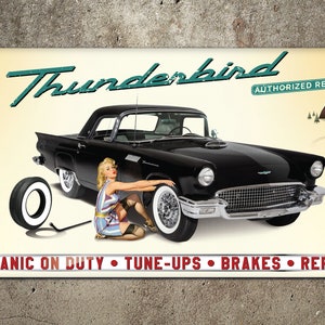 May include: A vintage style sign advertising Thunderbird Authorized Repair. The sign features a black 1950s era Thunderbird car with a woman in a pin-up style dress changing a tire. The sign also includes the text "Mechanic on Duty, Tune-Ups, Brakes, Repairs".