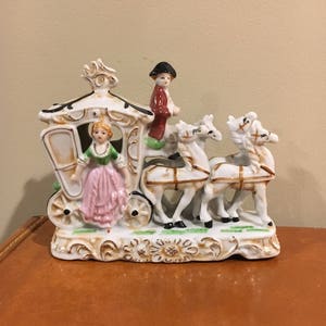 Vintage old horse and carriage figurine