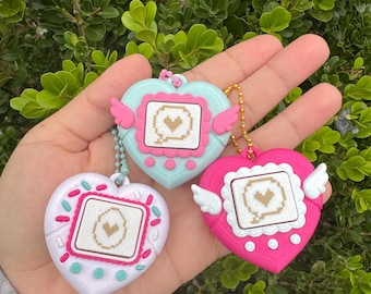 fidget clickers, cutesy girl keychains, pet clicker, 90s, virtual pets