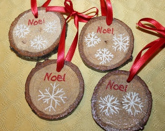 Set of 4 hand painted wood slice Christmas ornaments from our winter wonderland snowflake collection.  Great for decorating for as a gift.