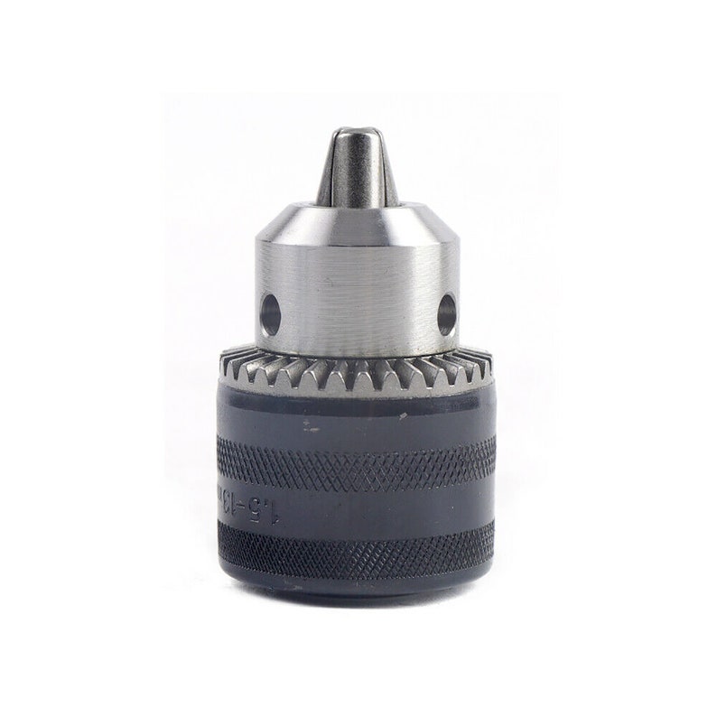 May include: A silver and black drill chuck with a keyless chuck and a black rubber grip. The chuck has a 1/2-inch capacity and is marked "1/2-13".