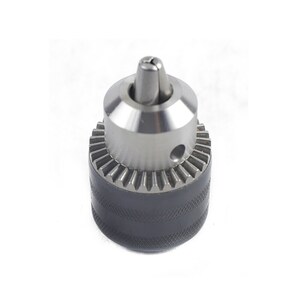 May include: A silver drill chuck with a black rubber grip. The chuck has a keyless design and a threaded end for attaching to a drill.