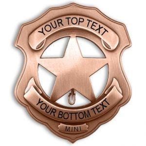 May include: A copper-colored sheriff's badge with a five-pointed star in the center. The badge has a scroll at the top and bottom with the text "YOUR TOP TEXT" and "YOUR BOTTOM TEXT". The badge also has the word "MINI" at the bottom.