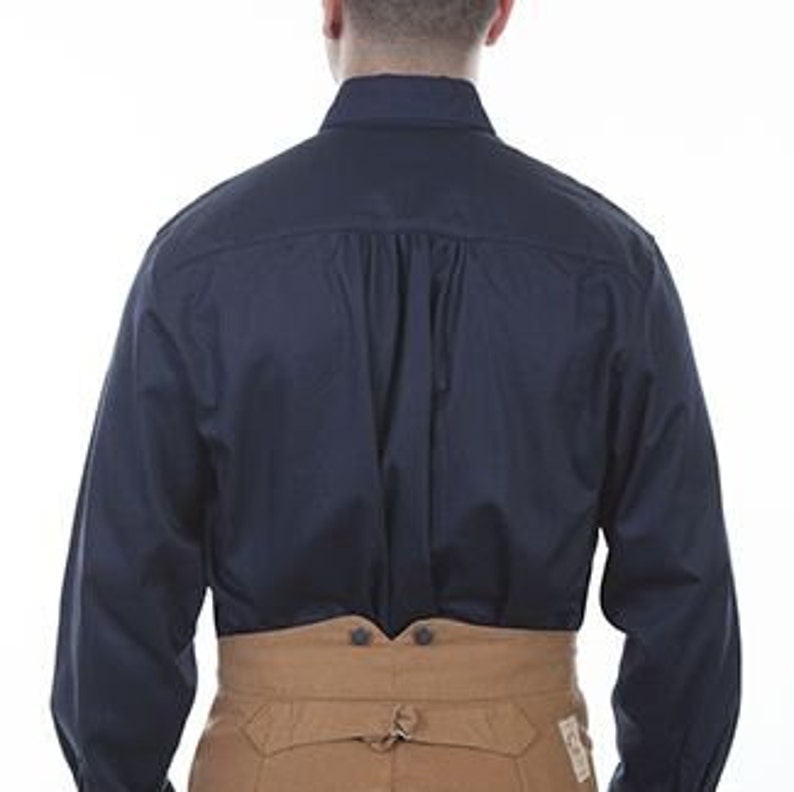 May include: A navy blue long-sleeved shirt with a button-down collar.