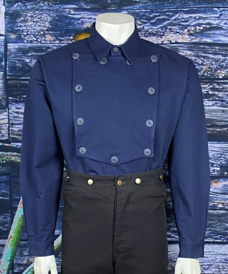May include: A navy blue long-sleeved shirt with a double-breasted front and gold buttons. The shirt has a pointed collar and a traditional button-up closure.
