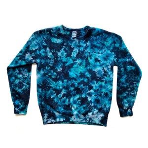 May include: A blue and green tie-dye sweatshirt with a crew neck.