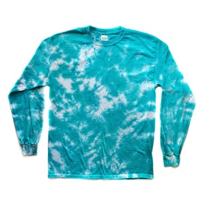 May include: A turquoise long-sleeve shirt with a white tie-dye pattern. The shirt has a crew neck and long sleeves.