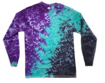 May include: A long-sleeved shirt with a tie-dye pattern in shades of purple, teal, and black.