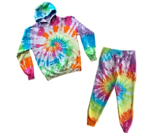May include: A tie-dye hoodie and sweatpants set in a rainbow swirl pattern. The hoodie has a drawstring hood and the sweatpants have a relaxed fit.